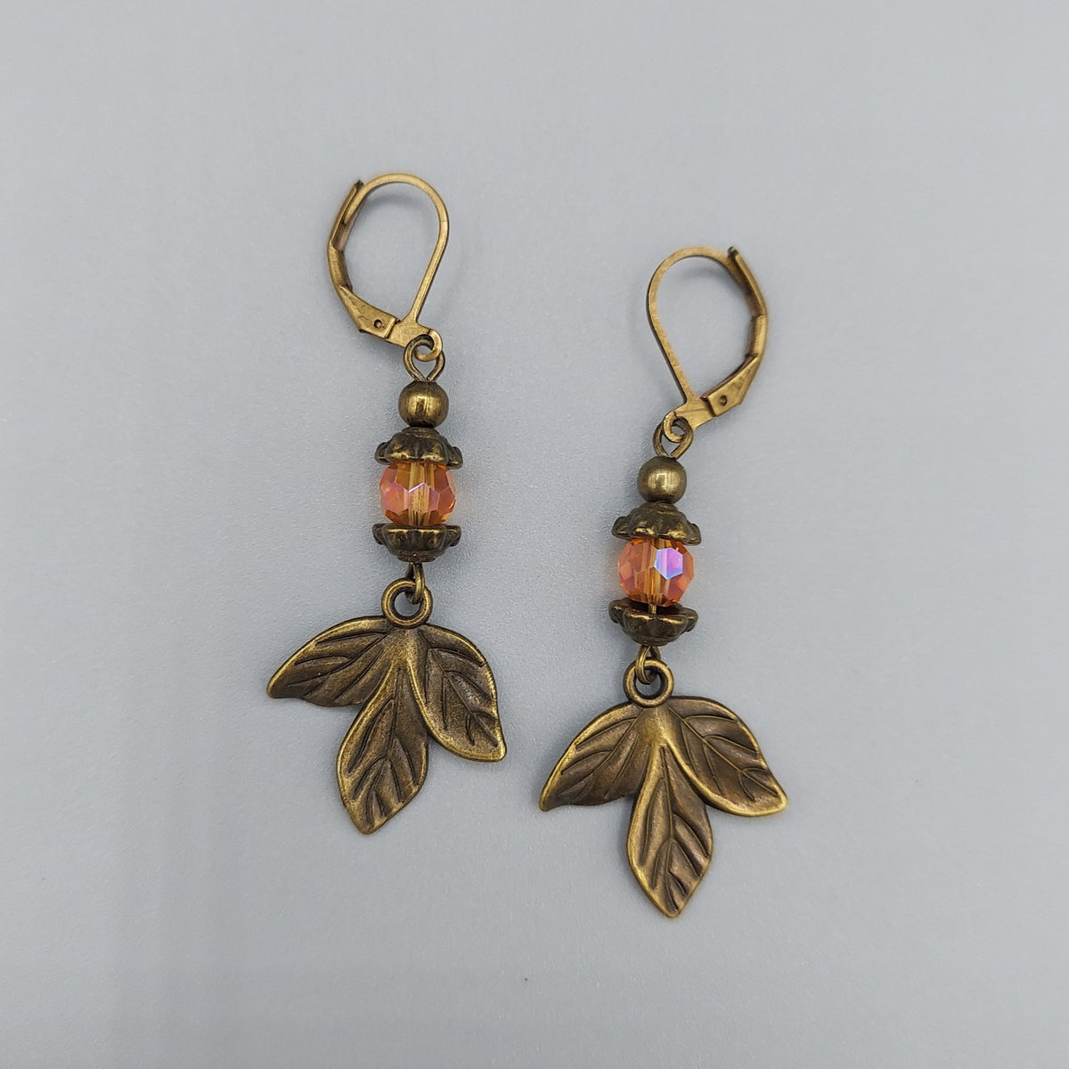 Antique Gold Leaf Earrings/Orange Crystals